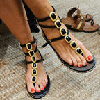 Sandalias negras piedras